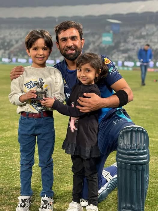 Iftikhar Ahmed with his son and daughter